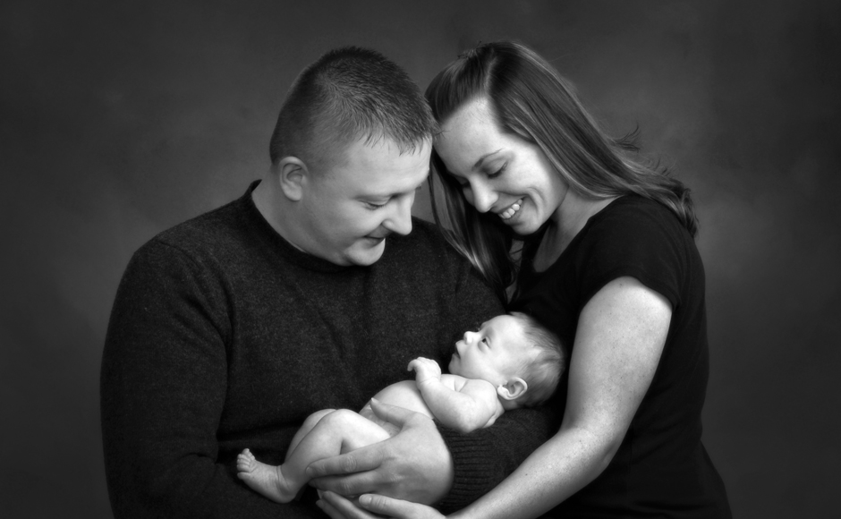 Mom & Dad holding baby - Cleary Creative Photography