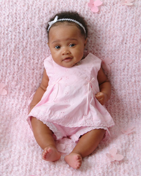 baby photograph of 3 month baby girl in pink dress sitting