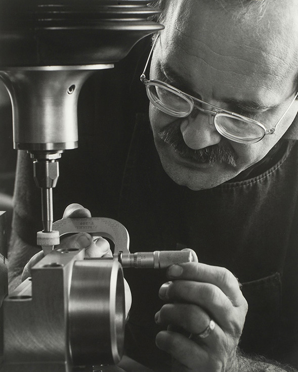 man using a mirometer at tool & die shop by Cleary Creative Photography in Dayton Ohio