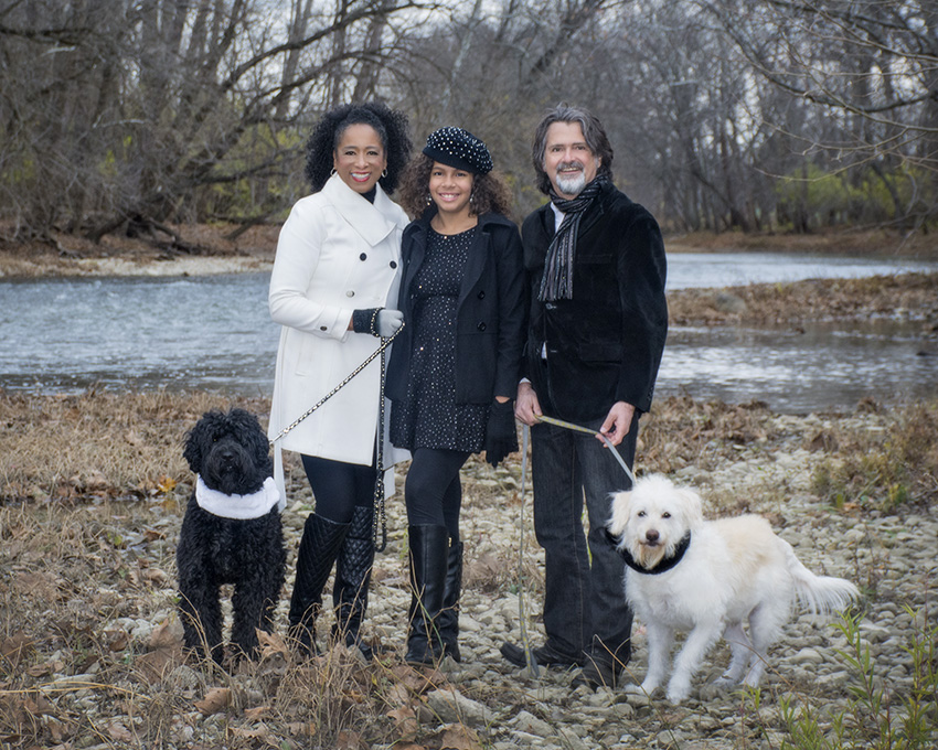 Outdoor family portrait by a river with their dogs by Dan Cleary of Cleary Creative Photography in Dayton Ohio