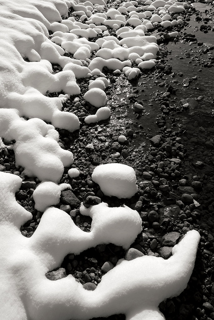 Black & White photograph of snow on Wolf Creek at Wesleyan MetroPark