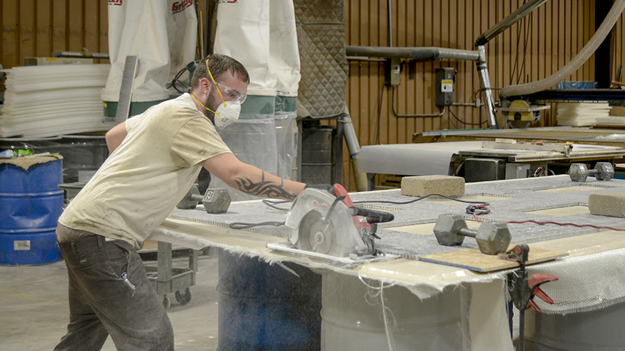 Industrial photograph of man using saw for company website by Dan Cleary of Cleary Creative Photography in Dayton Ohio