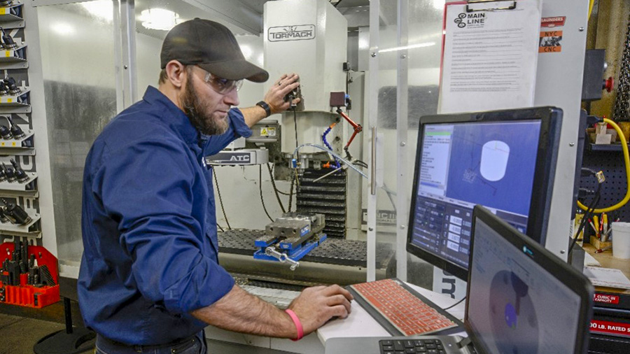 Man working in machine shop for company website by Dan C;leary of Cleary Creative Photography in Dayton Ohio