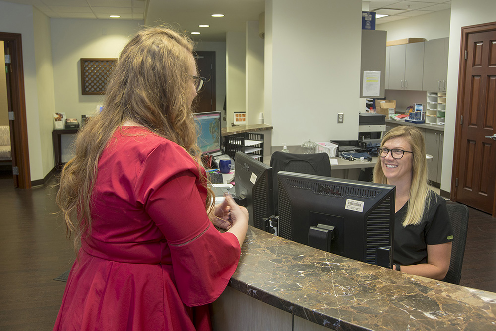 Photograph of doctors office waiting room with client and receptionist by Dan Cleary of Cleary Creative Photography in Dayton Ohio