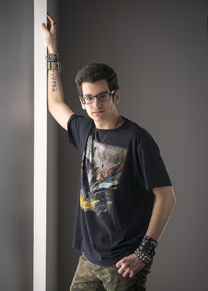 high school senior boy standing leanin against a wall by Dan Cleary of Cleary Creative Photography Dayton Ohio