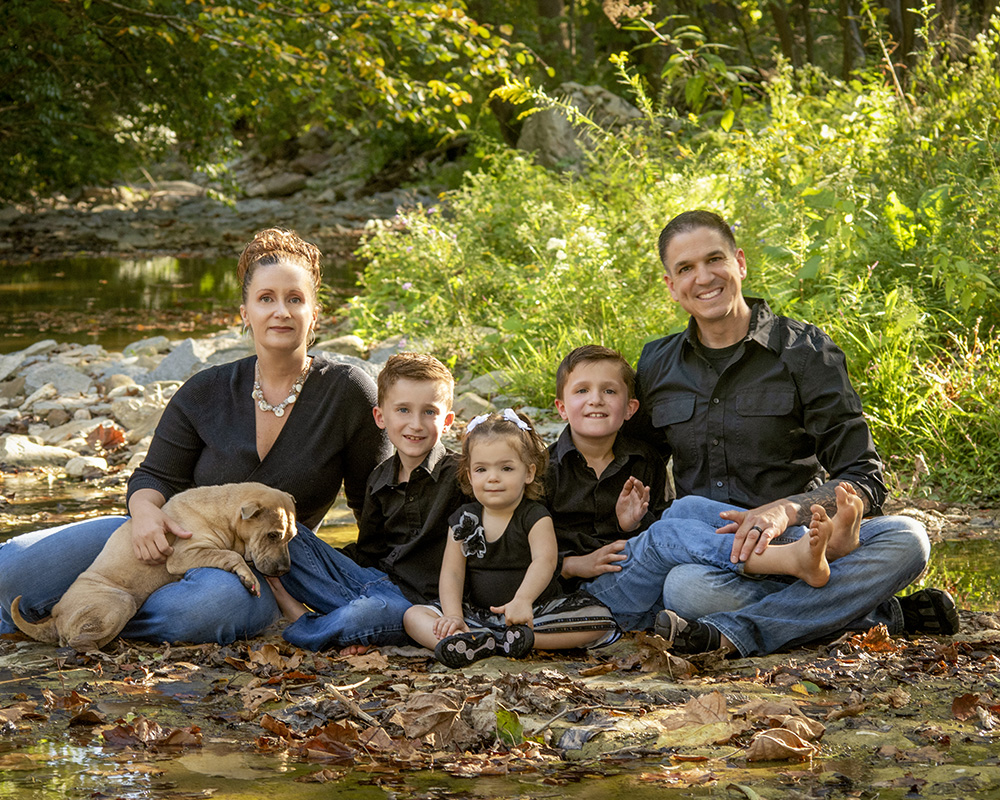 family portrait in backyard by pool by Dan Cleary of Cleary Creative Photography in Dayton Ohio