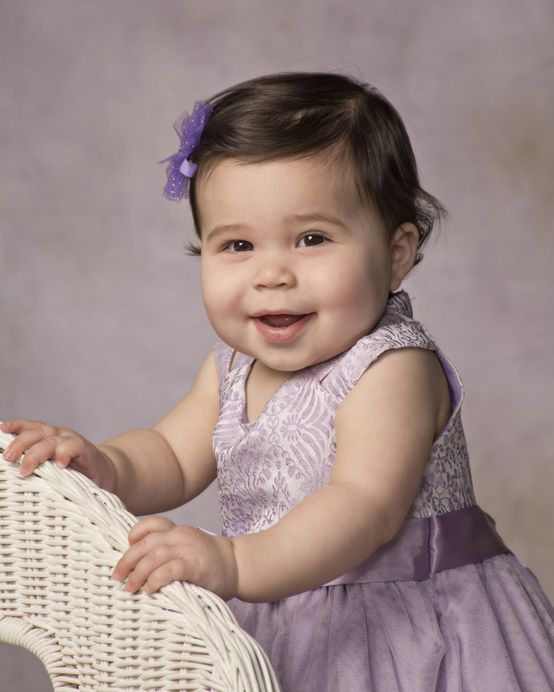 portrait of 1 year old baby girl with purple dress by Dan Cleary of Cleary Creative Photography in Dayton Ohio