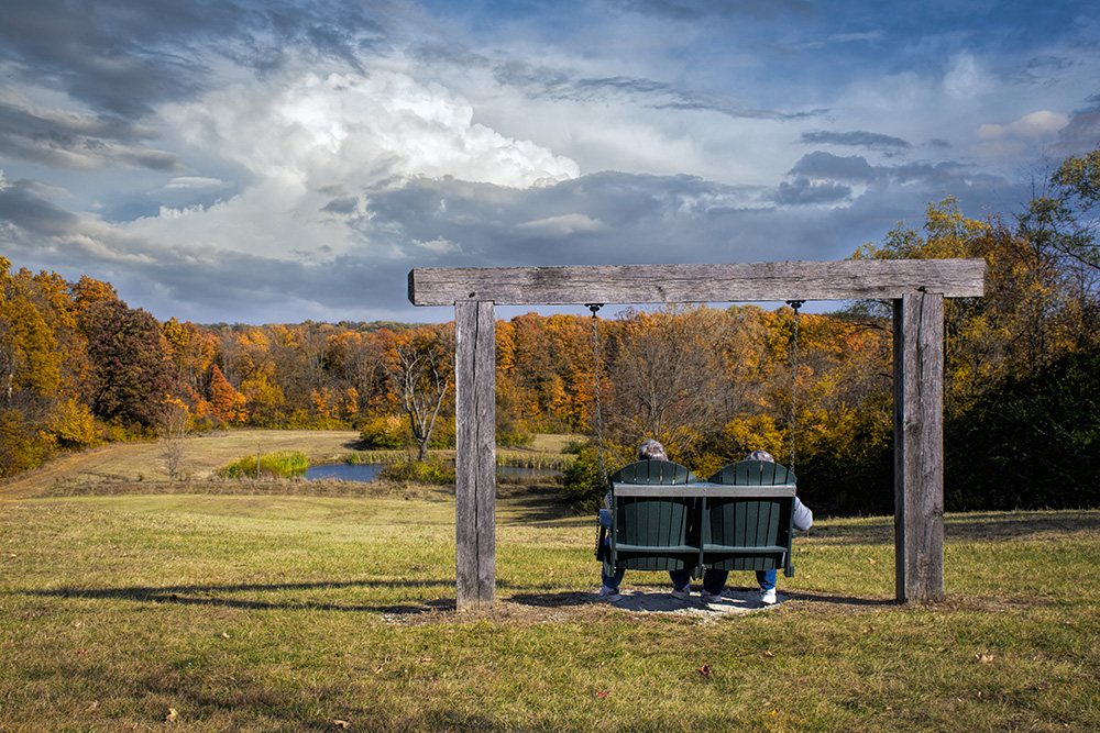 Couple sitting at Taylorsville Metro Park PHotoshop enhanced photo by Dan Cleary of Cleary Creative Photo