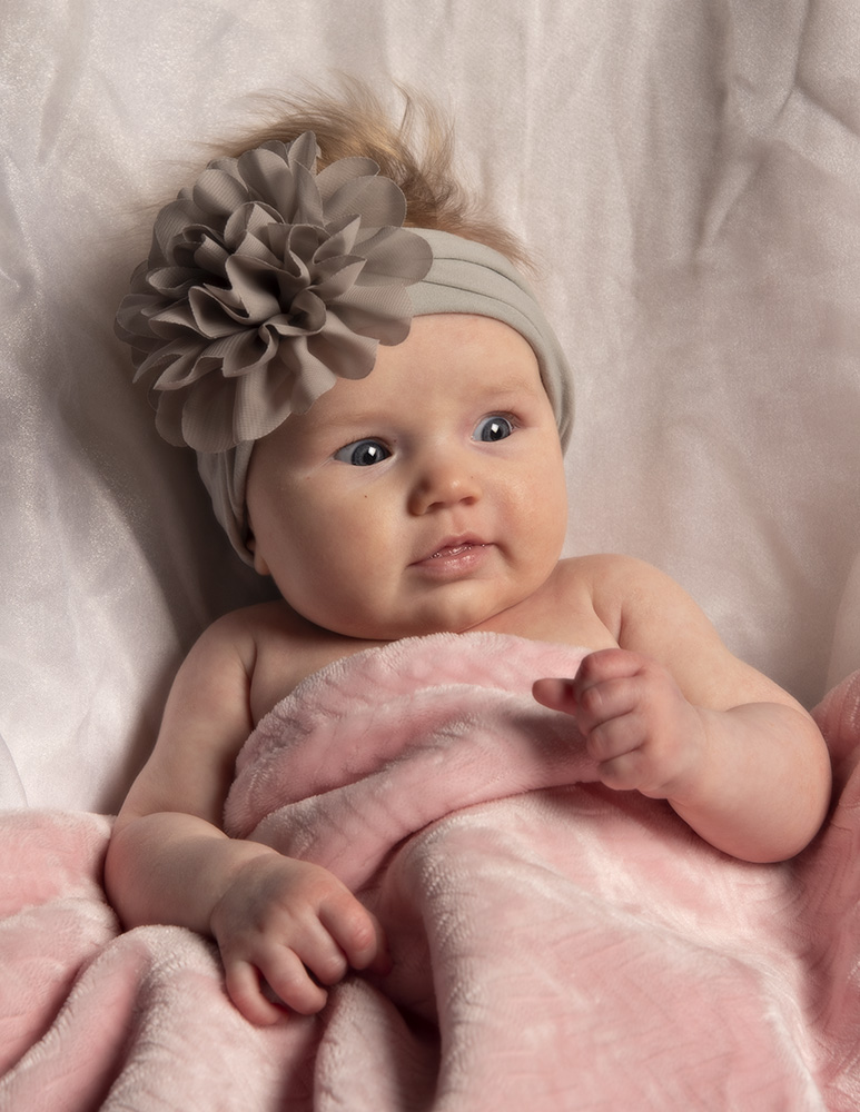 3 moonth old baby girl with pink blanket and gray headband by Cleary Creative Photography in Dayton Ohio