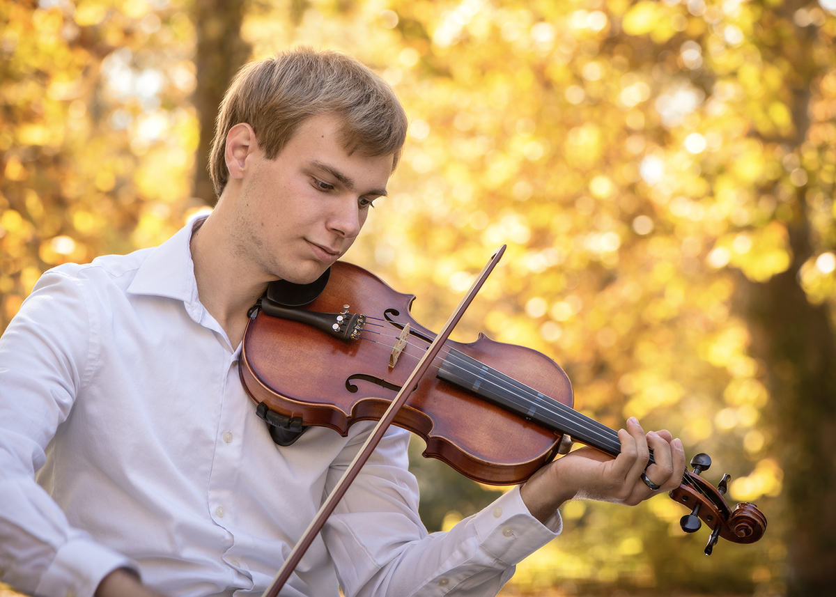 high school senior boy photographed with violin in the fall by Dan Cleary Dayton Ohio