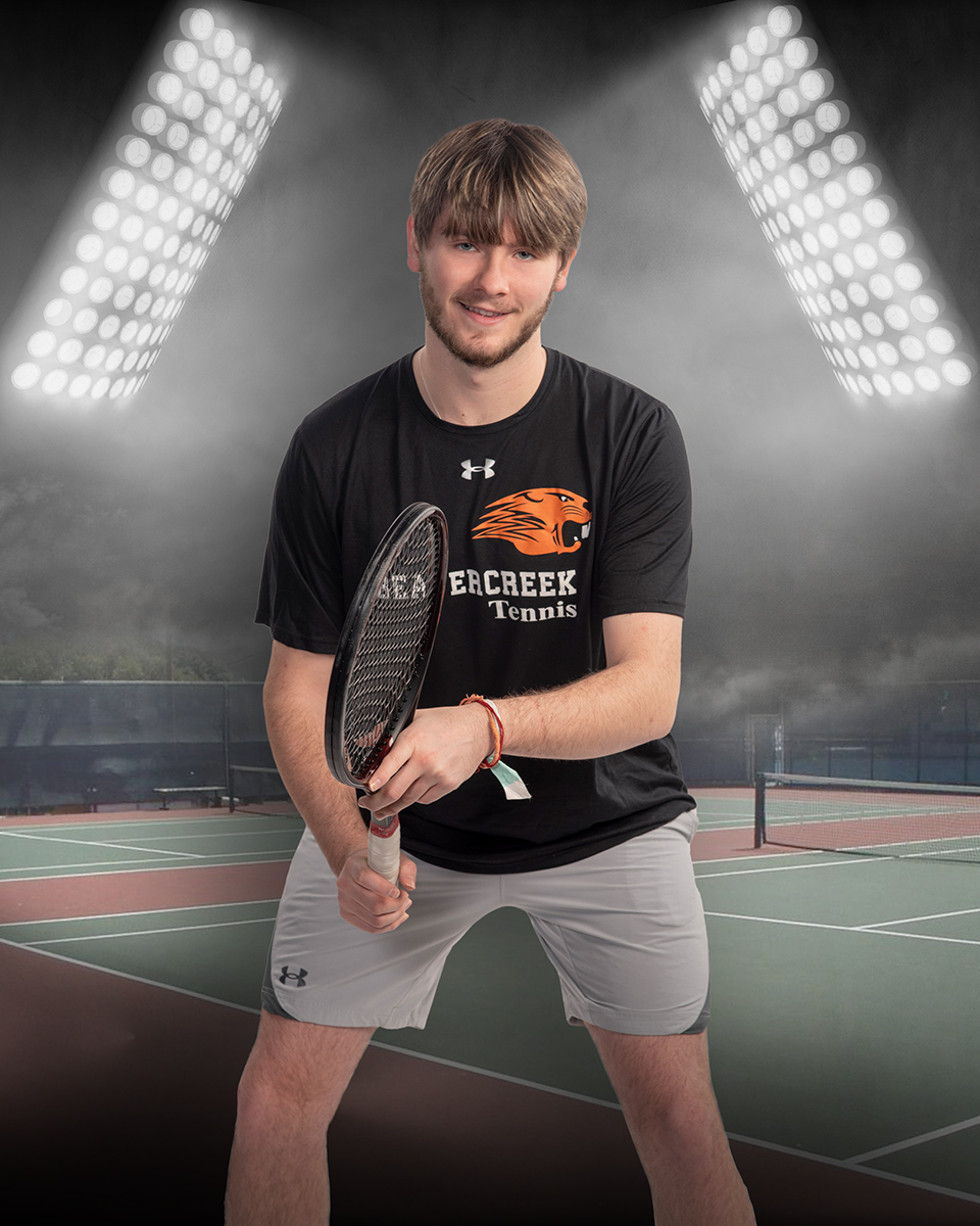 high school senior boy tennis player with stadium lights by Dan Cleary Dayton Ohio