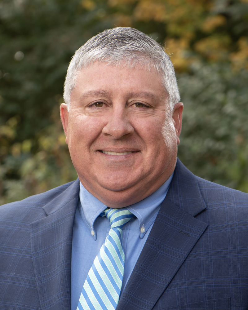 Outdoor location business portrait of a man