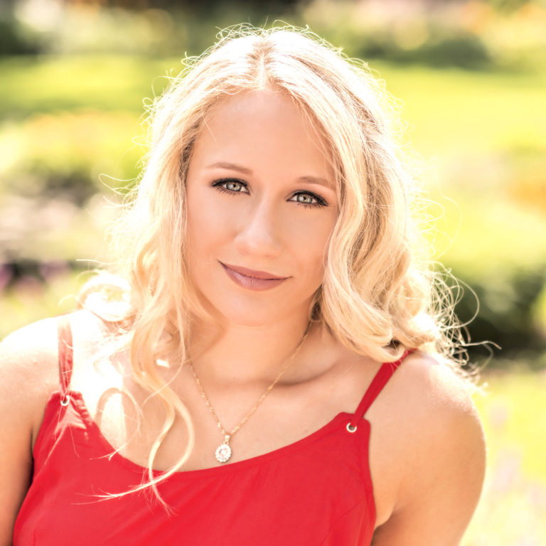 outdoor high senior portrait of girl in a red dress by Dan Cleary