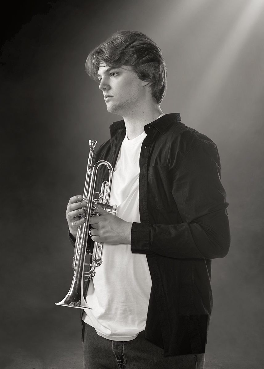 High School senior portrait boy with his trumpet by Dan Cleary